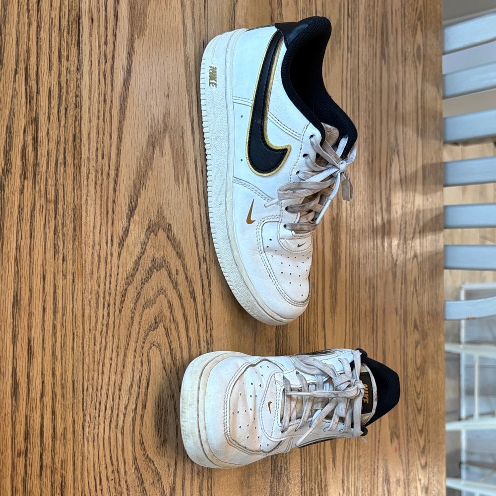 Nike White Sneakers with Black and Gold Details
